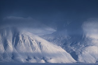 Snow-covered mountains, veil of clouds, Woodfjord, Svalbard and Jan Mayen, Norway, Europe