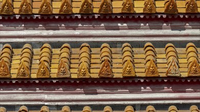 Roof decoration at the Uposatha Hall, Ubosot, the roof is staggered in three tiers and covered with