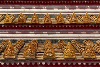 Roof decoration at the Uposatha Hall, Ubosot, the roof is staggered in three tiers and covered with