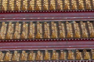 Roof decoration at the Uposatha Hall, Ubosot, the roof is staggered in three tiers and covered with