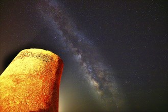 Tower under a clear night sky, illuminated by stars and the Milky Way, Valgonera, Majorca, Balearic