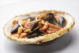 Steaming italian seafood stew baked in bread loaf