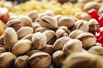 Closeup view at pistachio nuts on kitchen table. Vegetarian food concept