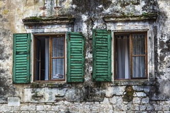 Wooden window with louvers in old house in the Kotor, Montenegro, Europe