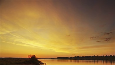 Beautiful landscape with colorful sunset sky over river background