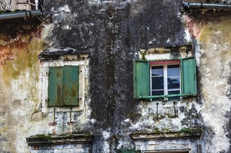 Wooden window with louvers in old house in the Kotor, Montenegro, Europe