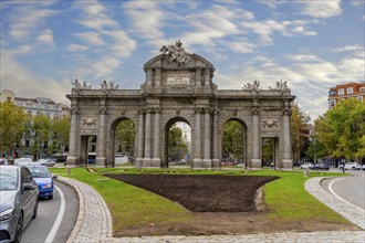 The Puerta de Alcalá is a Neo-classical gate in the Plaza de la Independencia in Madrid, Spain,