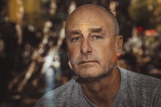 Portrait, man, camera view, beard, unshaven, bald head, background blurred, edge of forest,