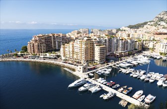 Montecarlo, Monaco, August 2022: panoramic view of the Fontvielle port with blue sky and sea,