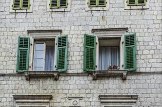 Wooden window with louvers in old house in the Kotor, Montenegro, Europe