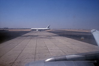 Aeroplane on the runway in perch position, airport, Cairo, Egypt, September 1989, vintage, retro,