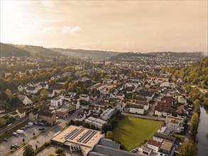 Urban landscape from above with houses, hills and river in autumnal mood, Nagold, Black Forest,