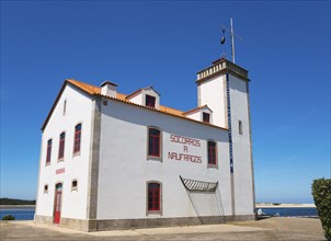 A white and red building with a tower by the sea under a clear blue sky, lighthouse, Esposende,