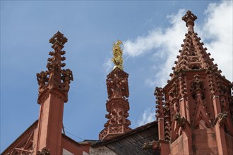 Towers and golden statue of the Virgin Mary of the Gothic St Mary's Chapel, Würzburg, Lower