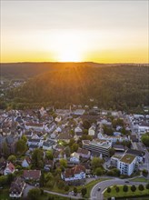 City panorama at sunset with houses and green landscape, mountains in the background, Nagold, Black