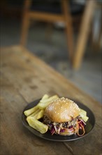 Pulled pork bun with thick fries