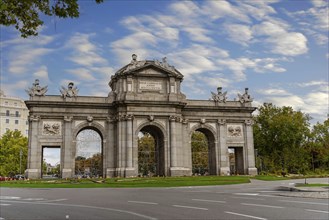 The Puerta de Alcalá is a Neo-classical gate in the Plaza de la Independencia in Madrid, Spain,