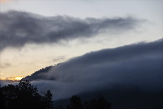 Autumn atmosphere, wafts of mist over a mountain range, Mugel mountain, Leoben, Styria, Austria,