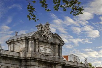 The Puerta de Alcalá is a Neo-classical gate in the Plaza de la Independencia in Madrid, Spain,