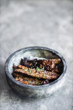 Grilled marinated pork ribs with asian sweet sesame sauce