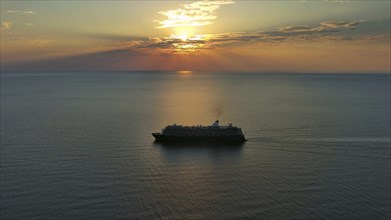 Aerial view at the cruise ship during sunset. Landscape with cruise liner on Adriatic sea.