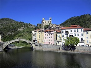 Village on Italian Coast with castle and stone bridge