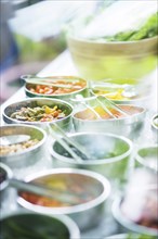 Salad bowls with mixed fresh vegetables in display