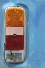 Detail of a Brake Light on a Weathered Vintage Camper Van