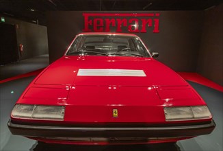 Turin, Italy, 11 november 2023: Car Museum. Red Ferrari 365 GT4, 1973. Italian design, luxury