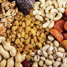 Flat lay view at assorted dried fruits and nuts. Healthy vegetarian food concept