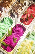 Classic mixed traditional italian gelato ice cream in shop display