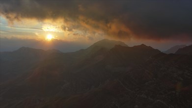 Aerial view of spectacular sunset on the mountain valley. Beautiful view in Durmitor National Park,