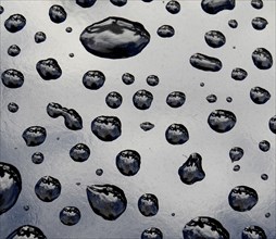 Background Of Pristine Water Drops On Black Metal Surface