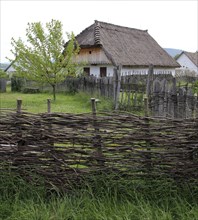 Country house with wicker cane fence