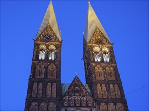 Twin towers of a church in front of a clear sky at dusk or at night, Bremen, Germany, Europe