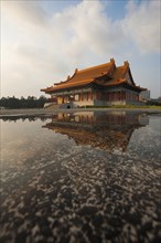 A water reflection of the National Concert Hall in Liberty Square of downtown Taipei