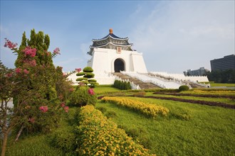 Colorful flowers and grass at the base of the Chiang Kai Shek Memorial Hall in Taipei. Horizontal