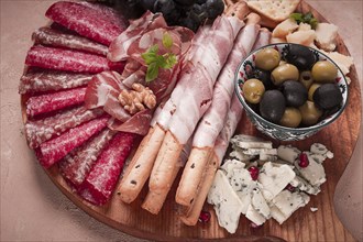 Appetizer, assortment, set, sausage, and cheese, on a wooden board, top view, no people