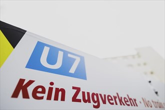 A sign indicates the suspension of train services on the underground line 7 in Berlin, 27 February