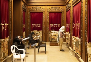 Jerusalem, Israel, 15 April, 2022: Orthodox jews is praying in synagogue near Sacred Western