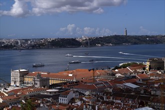 View from Castelo de São Jorge to old town, city view, river Rio Tejo with ferries, ferry boats,