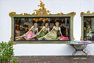 Shop window of fashion shop for traditional costumes, female mannequins, woman in dirndl, Wallgau,