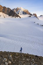 High alpine mountain landscape at sunset, Glacier du Tour, mountaineer in front of glacier and