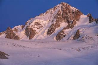 High alpine mountain landscape at sunset, Glacier du Tour, glacier and mountain peak, summit of the