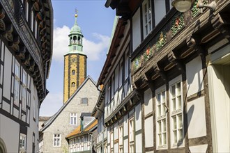 Artful half-timbered houses in the old town with a view of the Goslar Market Church of St Cosmas