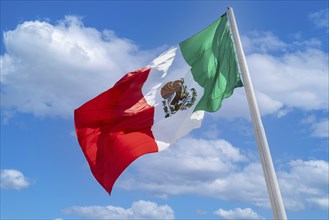 Los Cabos San Jose Del Cabo, Mexico, Mexican tricolor national striped flag proudly waving at mast,