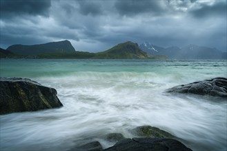 Seascape on the beach at Haukland. View of the mountains of Vestvagoya and Myrland on Flakstadoya.