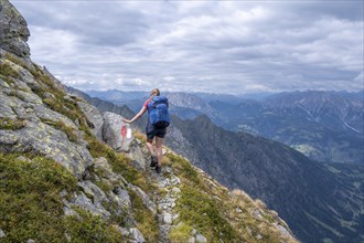 Hiker on the Carnic High Trail, ascent to the Raudenspitze, Carnic Main Ridge, Carnic Alps,