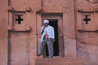 Lalibela, eastern group of rock-hewn churches, pilgrims at the entrance to the Bete Abba Lebanon,