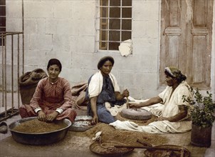 Peasant woman grinding grain, Jerusalem, today Israel, Historical, digitally restored reproduction